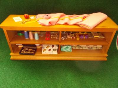 Filled Dress Shop Cabinet